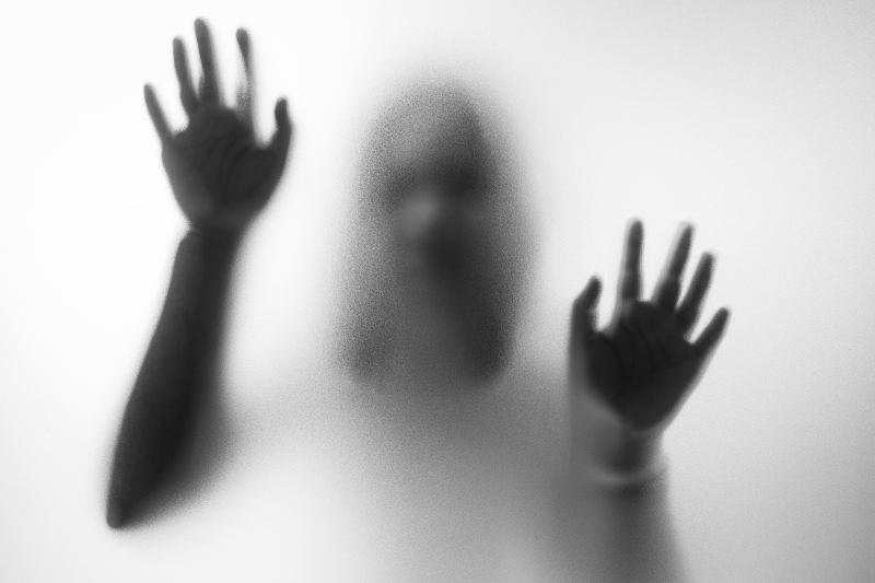 Shadowy face emerging from fog