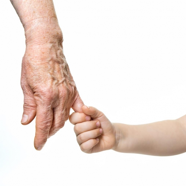 Grandparent and grandchild holding hands