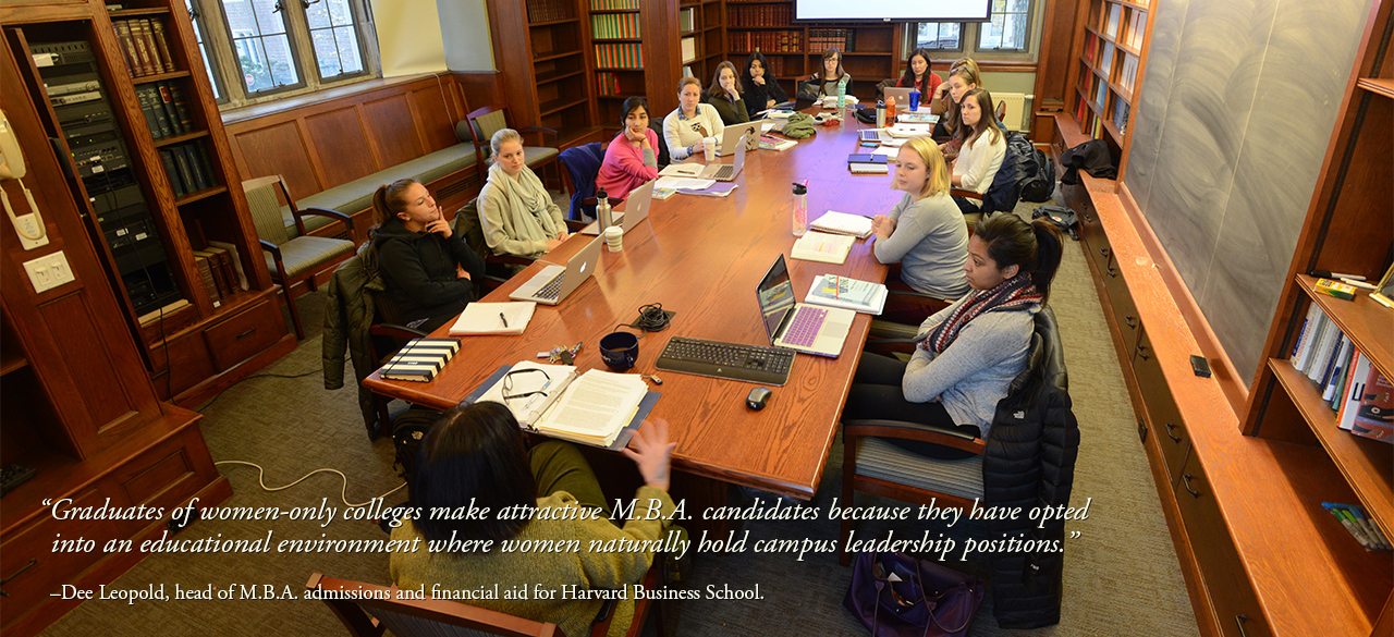 Top Business Schools Hope to Attract Women's College Graduates Wellesley students gathered around a classroom conference table.