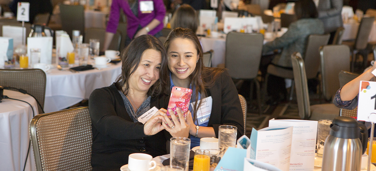 Student Chosen As Finalist In National Essay Contest Leilani Stacy ‘18, a finalist in a national essay contest, snaps a picture with her mother at a gathering hosted by the contest’s sponsoring organization, Womenetics.
