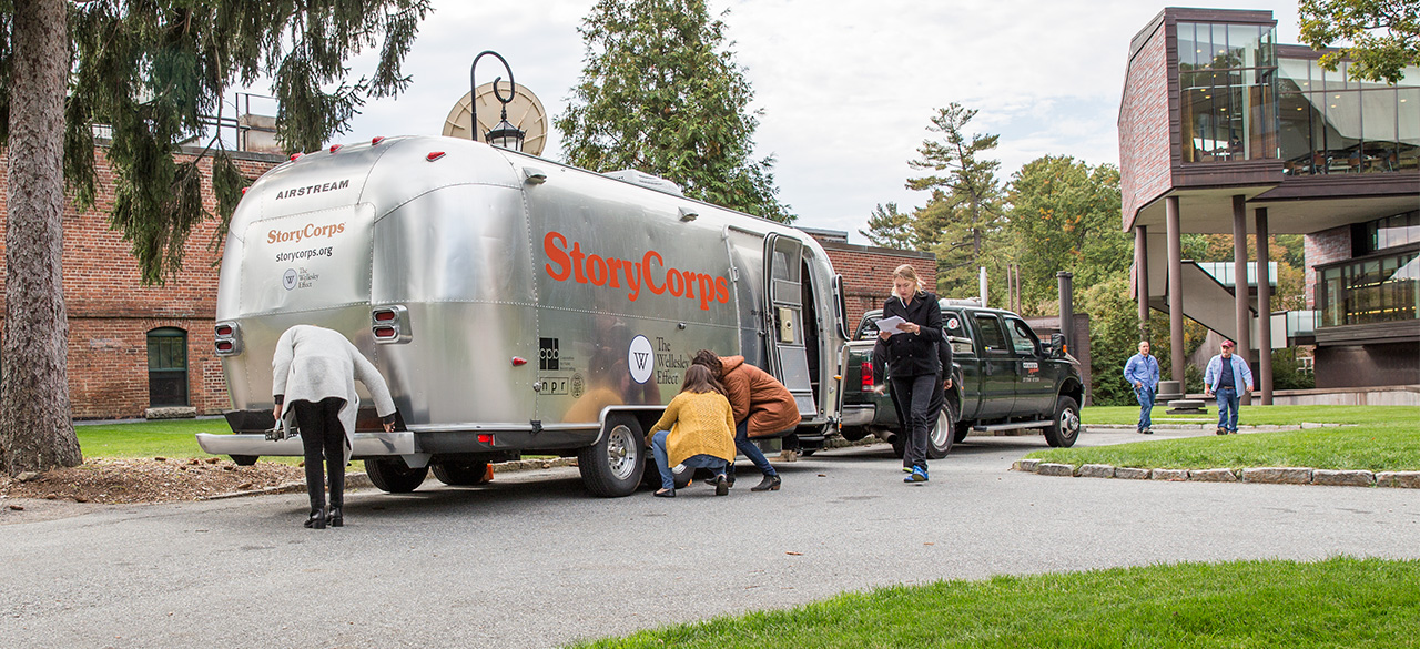 The StoryCorps MobileBooth Visits Wellesley Campus A silver airstream trailer, the StoryCorps MobileBooth, parked near the Wellelsey student center