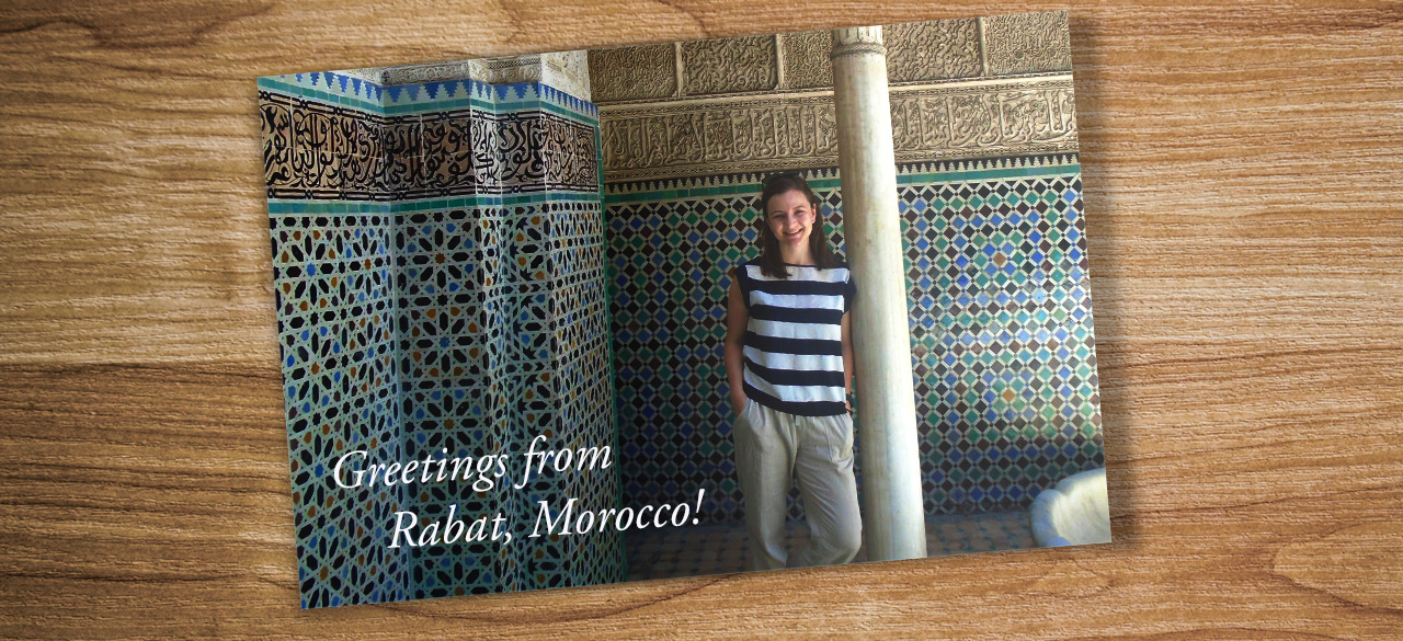 Postcards Series: Catherine Puga '17 A postcard on a table shows Catherine Puga '17 in Rabat Morocco