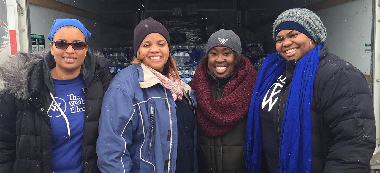 Wellesley Alumnae Aid Flint Residents Marseille "Mars" Allen '01, Jamilah Freeman '02, Dana Weekes '03, and Hollee Mangrum-Willis '04 in Flint, Michigan.