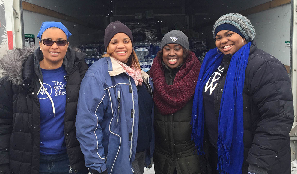 Wellesley Alumnae Aid Flint Residents Marseille "Mars" Allen '01, Jamilah Freeman '02, Dana Weekes '03, and Hollee Mangrum-Willis '04 in Flint, Michigan.