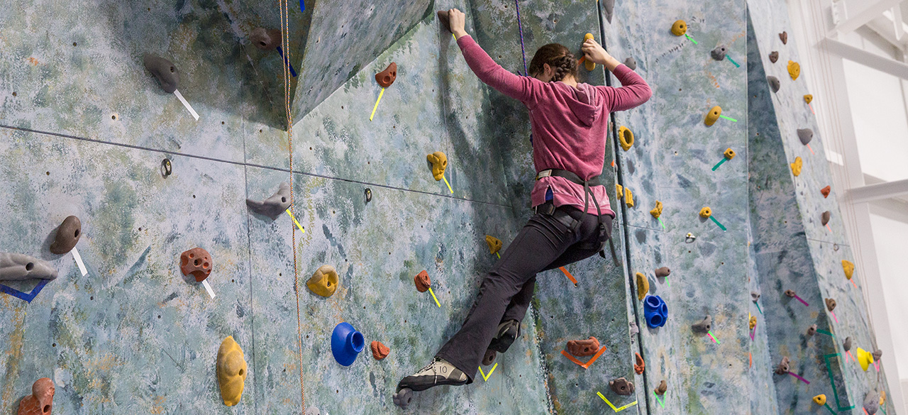 Exercise Enhances Students’ Lives, on Campus and Beyond Rock climbing demonstrated by Katherine Morris ’17