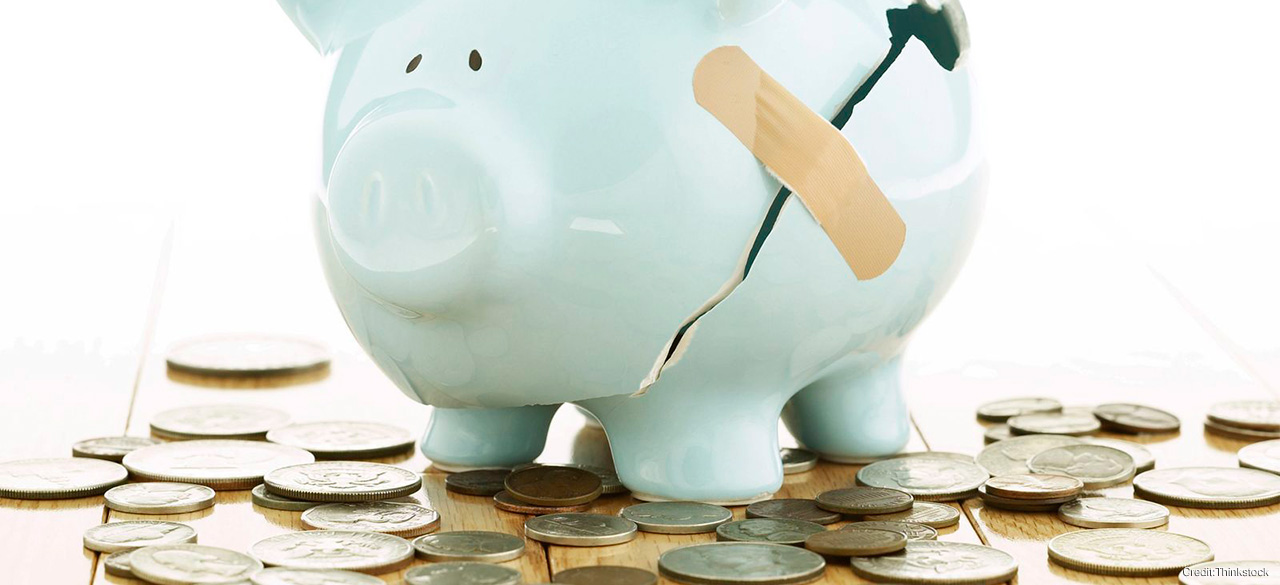 Professors Weigh in on Federal Economic Policies A bandaid holds together a broken piggybank, coins lay around it