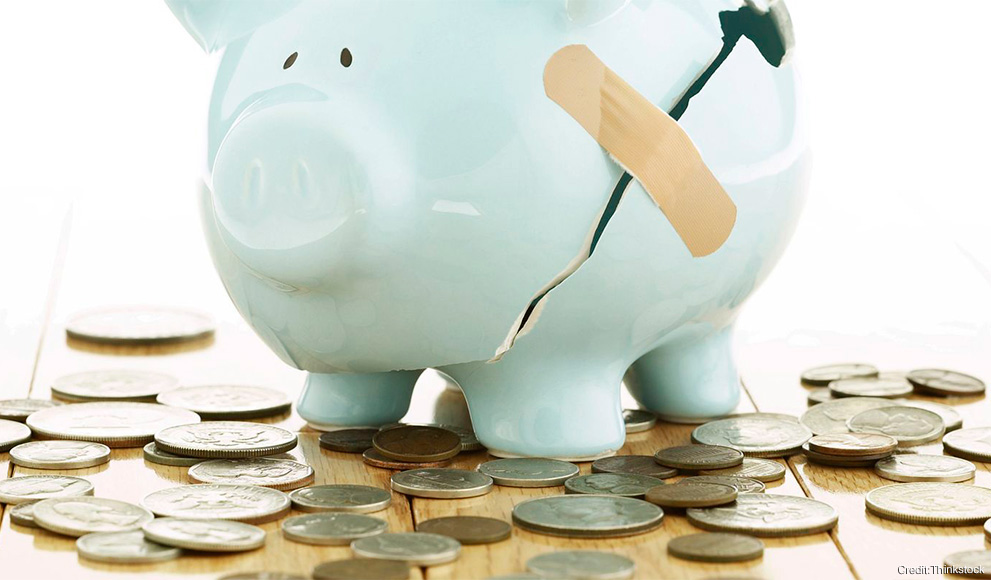 Professors Weigh in on Federal Economic Policies A bandaid holds together a broken piggybank, coins lay around it