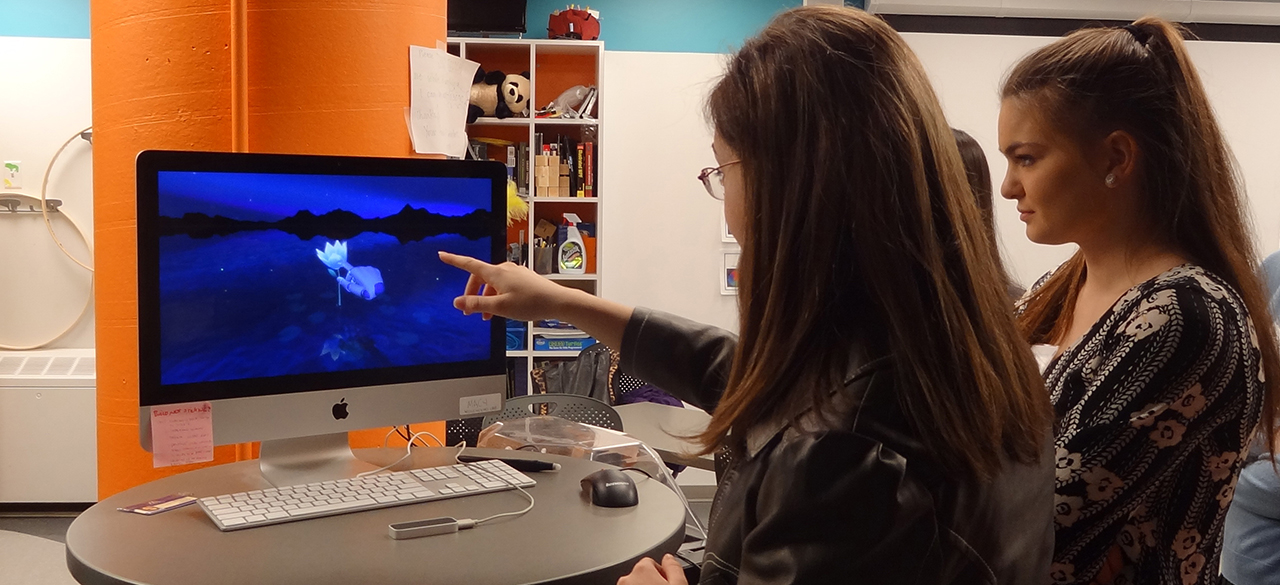 High school student tries one of the computers in Wellesley’s HCI Lab.