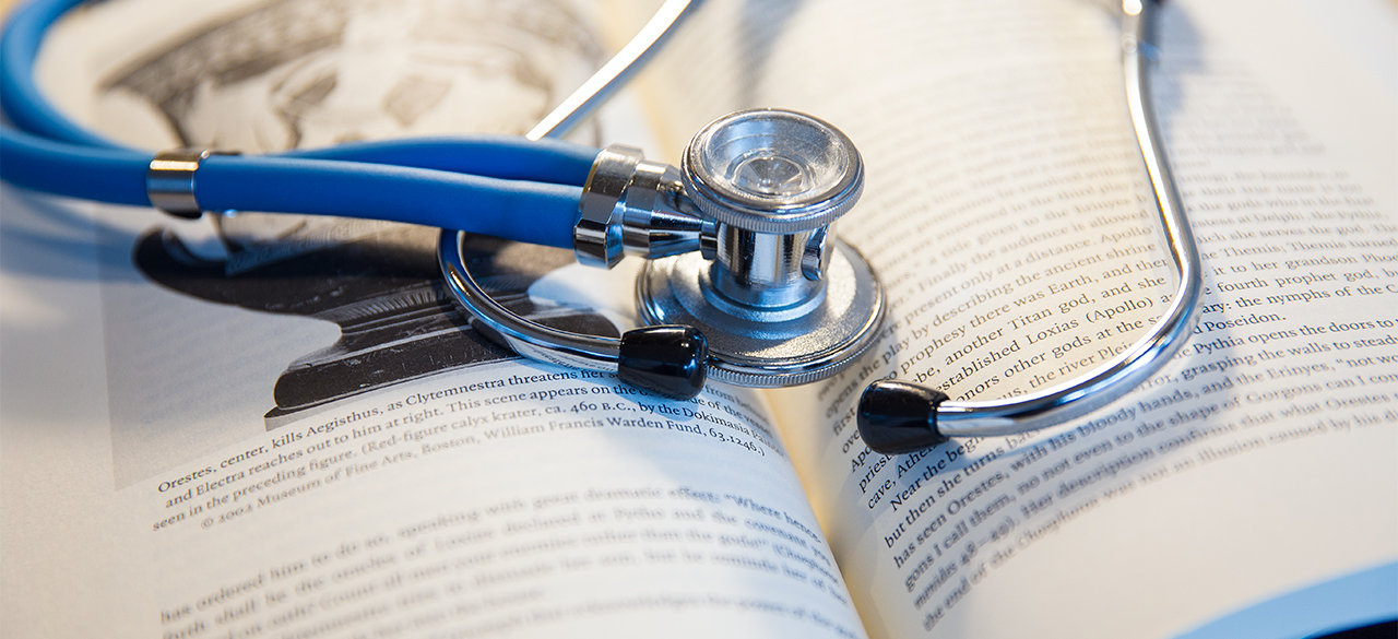 Praise For The Power of The Liberal Arts In Science A stethoscope rests on an open book.