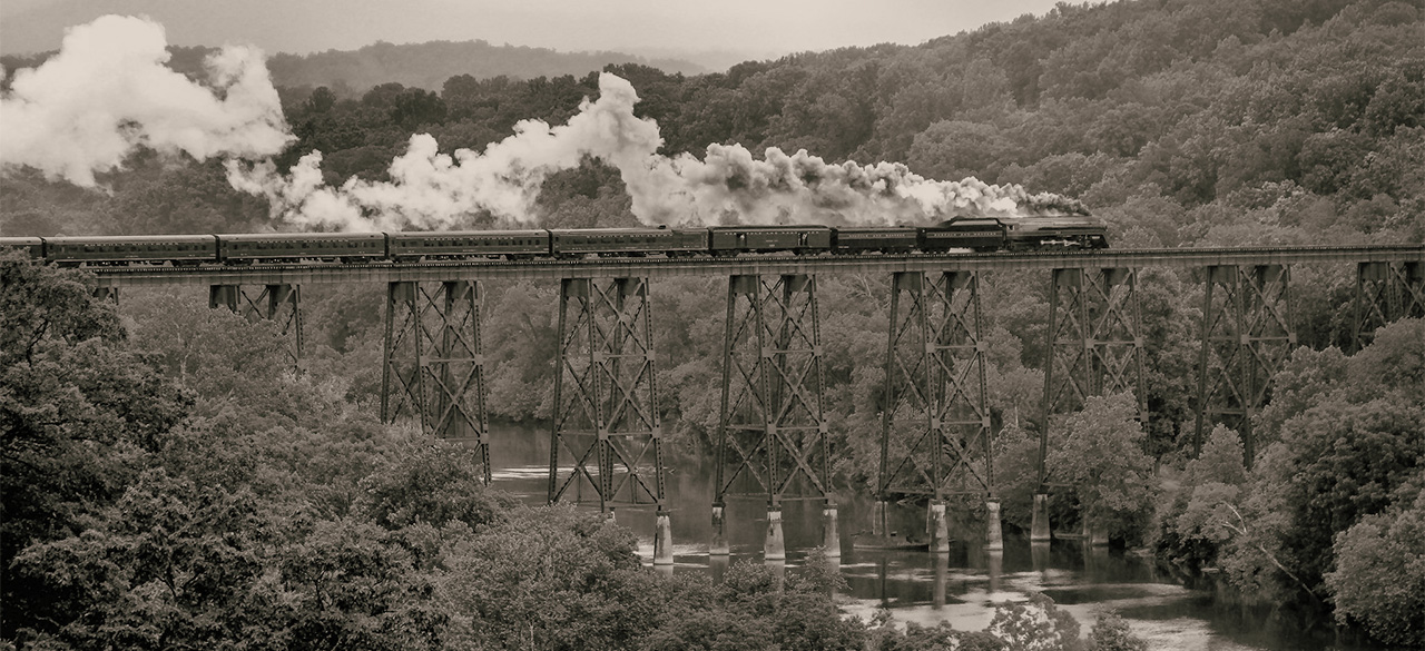 America the Beautiful: America’s Unofficial National Anthem Historic photo of train traveling across the United States