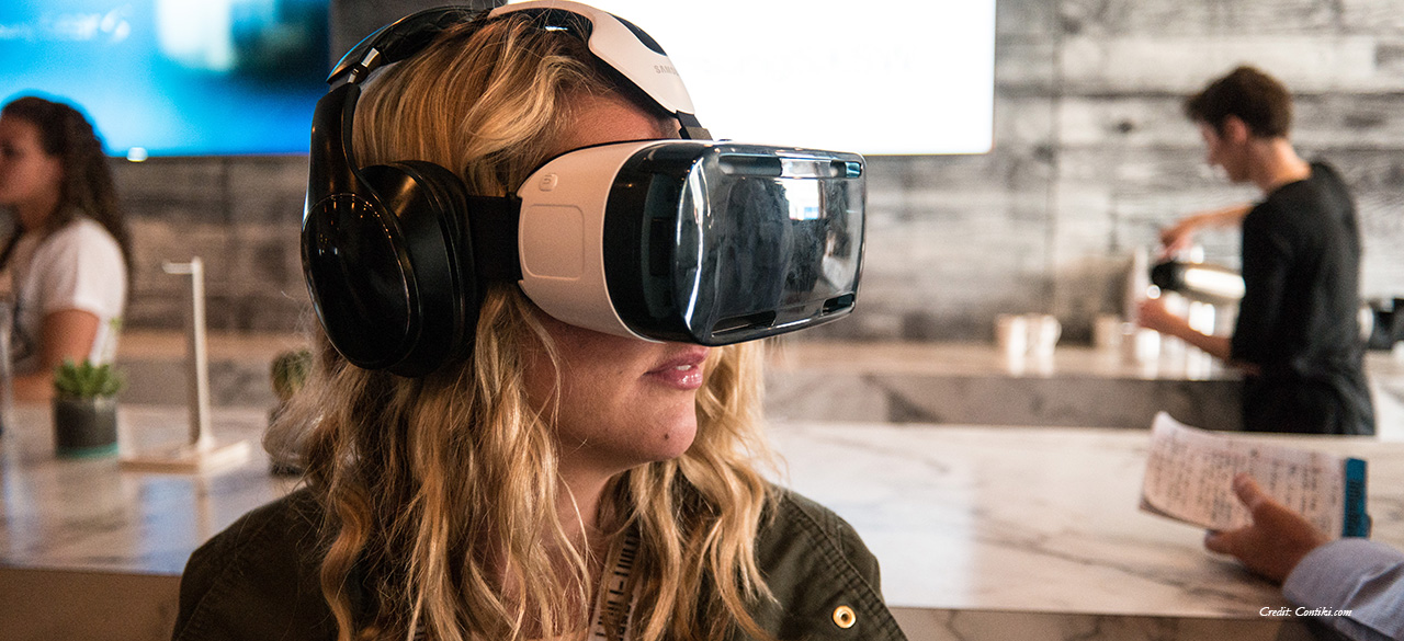 Alumna Creates Virtual Reality Museum Experiences Young woman uses virtual reality googles