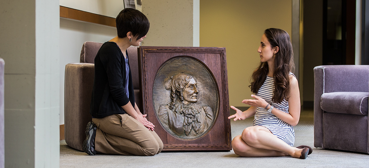 Student, Professor Locate Anne Whitney Bronze 30 Years After It Was Last Seen College Archivist Jane Callahan and Student Kathryn Cooperman discuss a bronze relief that was recently located in the College Archives after a months-long search.