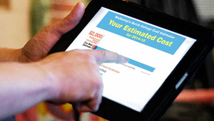 Hands shown using Wellesley's Cost Estimator Tool on an iPad