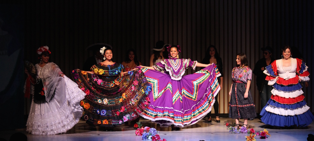Dancers are on stage during the Latina Culture Show