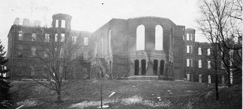 A missing roof and entrance of College Hall after the fire 