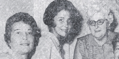 Suzy and two women at a Newhouse publications luncheon