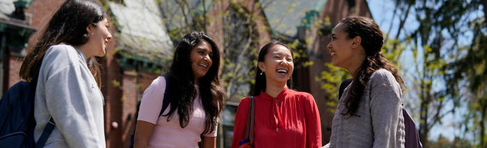 Four Wellesley students walking outside