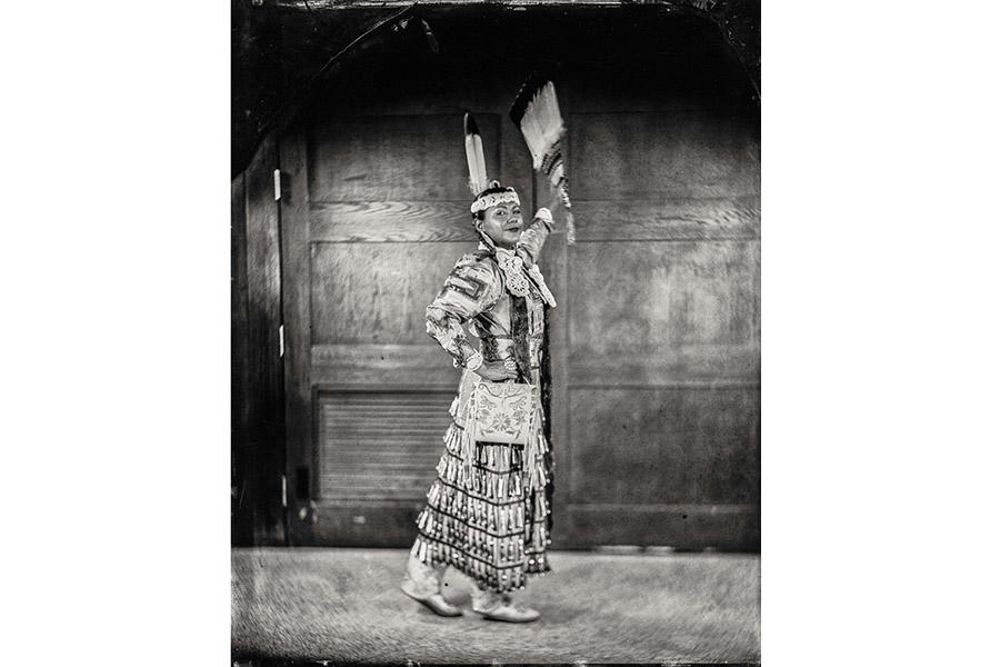 black and white photo of a Native American woman posing