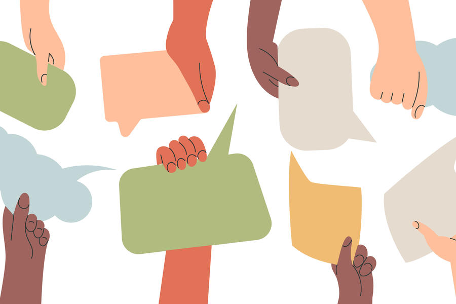 Stock image of hands holding speech bubbles