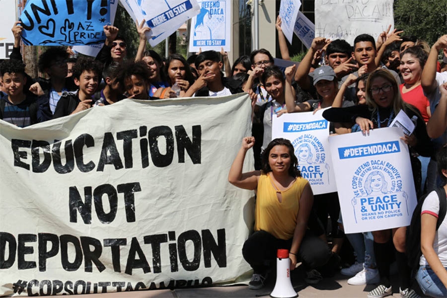 students holding peace signs at a immigration rally