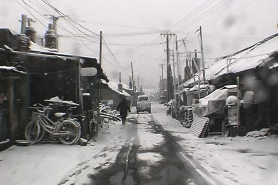still from Wang Bing's film west of the tracks