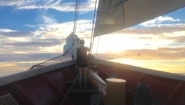 Wellesley Student Conducts Marine Research in the Atlantic Ocean Anthea Fisher ’17 watches the sun set over the Mediterranean Sea from the bow of the SSV Corwith Cramer.