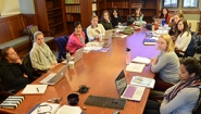 Wellesley students gathered around a classroom conference table.