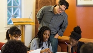 Wellesley Math Program Named a Bright Spot in Hispanic Education Professor Stanley Chang looks on as a group of students study together.