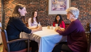 Pforzheimer Fund Internships Provide Students with Valuable Humanities Work Experiences Students talk with Betty Pforzheimer '59