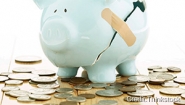 Professors Weigh in on Federal Economics Policies A bandaid holds together a broken piggybank, coins lay around it