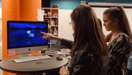 High school student tries one of the computers in Wellesley’s HCI Lab.