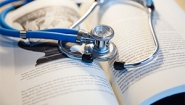 Praise For The Power of The Liberal Arts In Science A stethoscope rests on an open book.