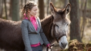 woman with donkey from aija-liisa ahtila's exhibition