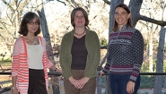 Wolfson, Lenares, and Brooks stand outside library