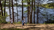 three women run by lake