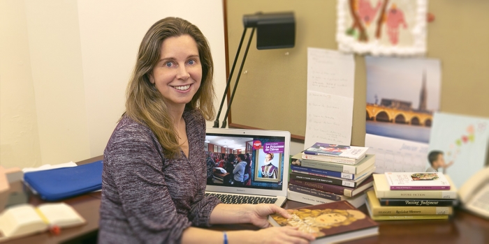 France’s First Modern Novel Gets Its First Digital Bilingual Edition Helene Bilis sits at her desk in the Newhouse Center