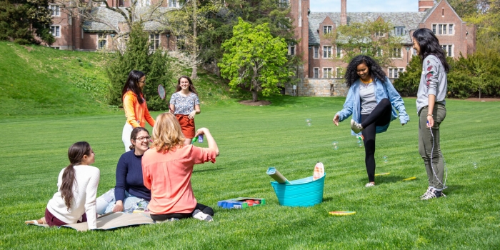 Wellesley Students Take a Break before Finals to Enjoy the Outdoors Students on Severance Green enjoy the outdoors in spring.