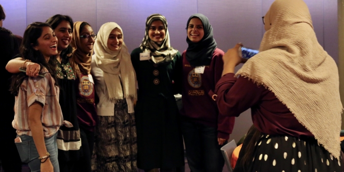 Al-Muslimat Celebrated 30 Years at Very Wellesley Weekend Students celebrate the 30th anniversary of Al-Muslimat by taking a photo after an event.