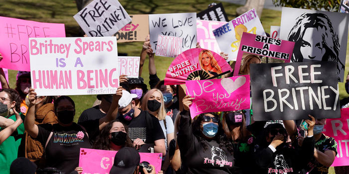 Why Britney Feels Like Your BFF: Understanding Social Media and Parasocial Relationships Britney Spears fans hold signs outside a Los Angeles court hearing concerning the pop singer’s conservatorship on March 17, 2021