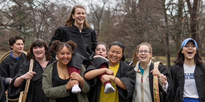 Paige Hauke ’19 Wins Wellesley’s 124th Annual Hooprolling Competition A Wellesley Senior is carried by her classmates after winning the hooprolling competition.