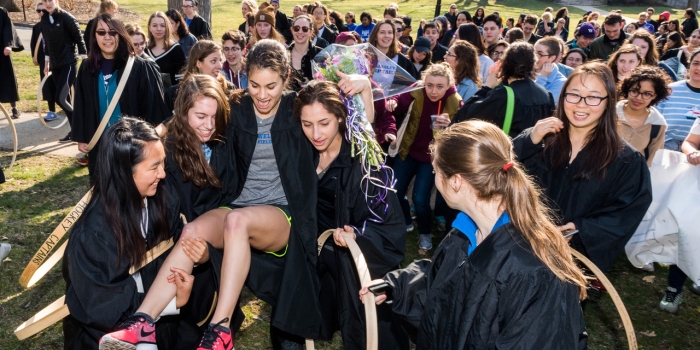 Emily Hamilton ’18 Wins Wellesley’s 123rd Annual Hooprolling Contest Emily Hamilton is carried by classmates after winning the 2018 Hooprolling competition.