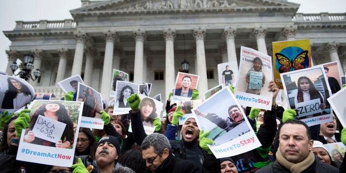 As SCOTUS Hears DACA Arguments, Alumna Helps Lead the Legal Challenge People outside of the Supreme Court protest the Trumps administration's decision to rescind DACA. They hold signs and chant.