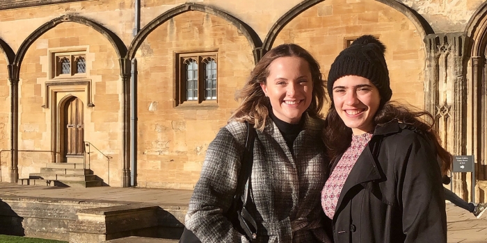 Two Years After Its Launch, The Wellesley Hive Continues to Thrive Two students stand outside a building in Oxford, England.