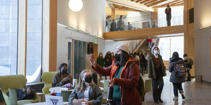 Professors from Wellesley College and University of Kansas Team Up to Study Social Impact of Face Masks Two students wearing face masks talk to each other in Wellesley's new Science Complex.