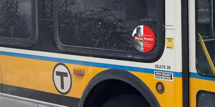 Wellesley Alum Prompts Massachusetts Leaders to Honor Rosa Parks on MBTA Buses A MBTA bus with a sticker of Rosa Parks by the door.