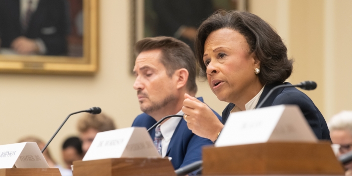 One Year after Report on Sexual Harassment in Academia, President Paula Johnson Testifies Before Congress on Findings and Bipartisan Legislation President Johnson speaks into a microphone while testifying on Capitol Hill.