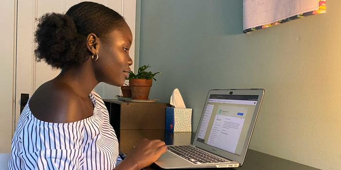 Mochi, a New Chatbot Life Coach, Aims to Help Users Maintain Well-being and Productivity During the Pandemic Adhel Geng ’22 working on a laptop