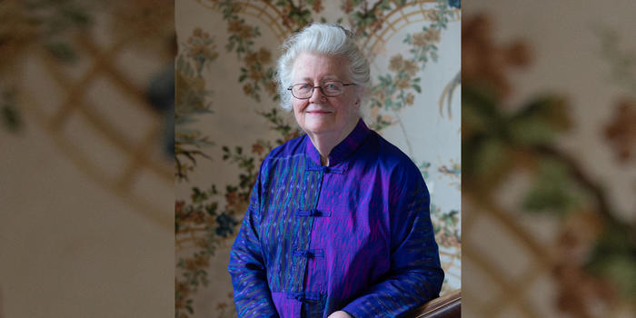 Acclaimed WCW Researcher Peggy McIntosh to be Inducted into the National Women’s Hall of Fame Peggy McIntosh on Cheever House’s grand staircase with original wallpaper and bannister dating from 1894.