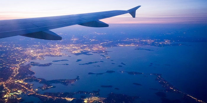Summer Send-Offs Prepare New Students for the Journey to Wellesley An airplane preparing to land over Boston's Logan airport