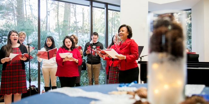 Wellesley Celebrates the Season with Holiday Brunch for College Staff A staff choir sings with President Johnson